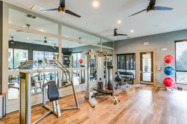 Fitness center featuring cardio and strengthening equipment